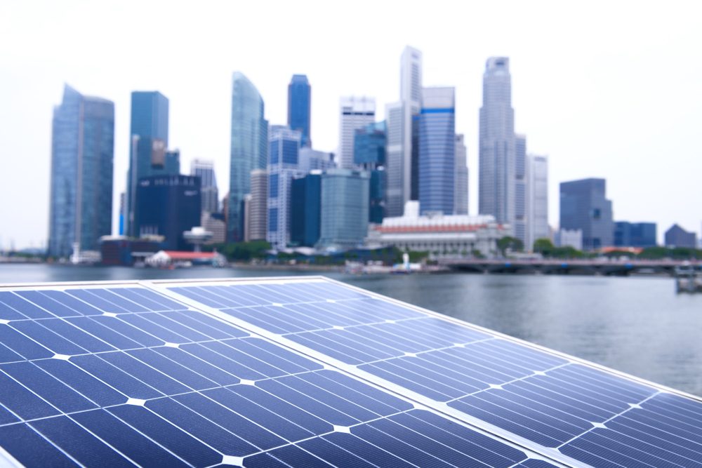 Solar panels with a city skyline
